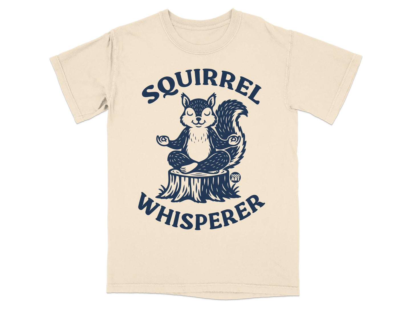 T-shirt graphic of a squirrel meditating on a tree stump with "Squirrel Whisperer" text.