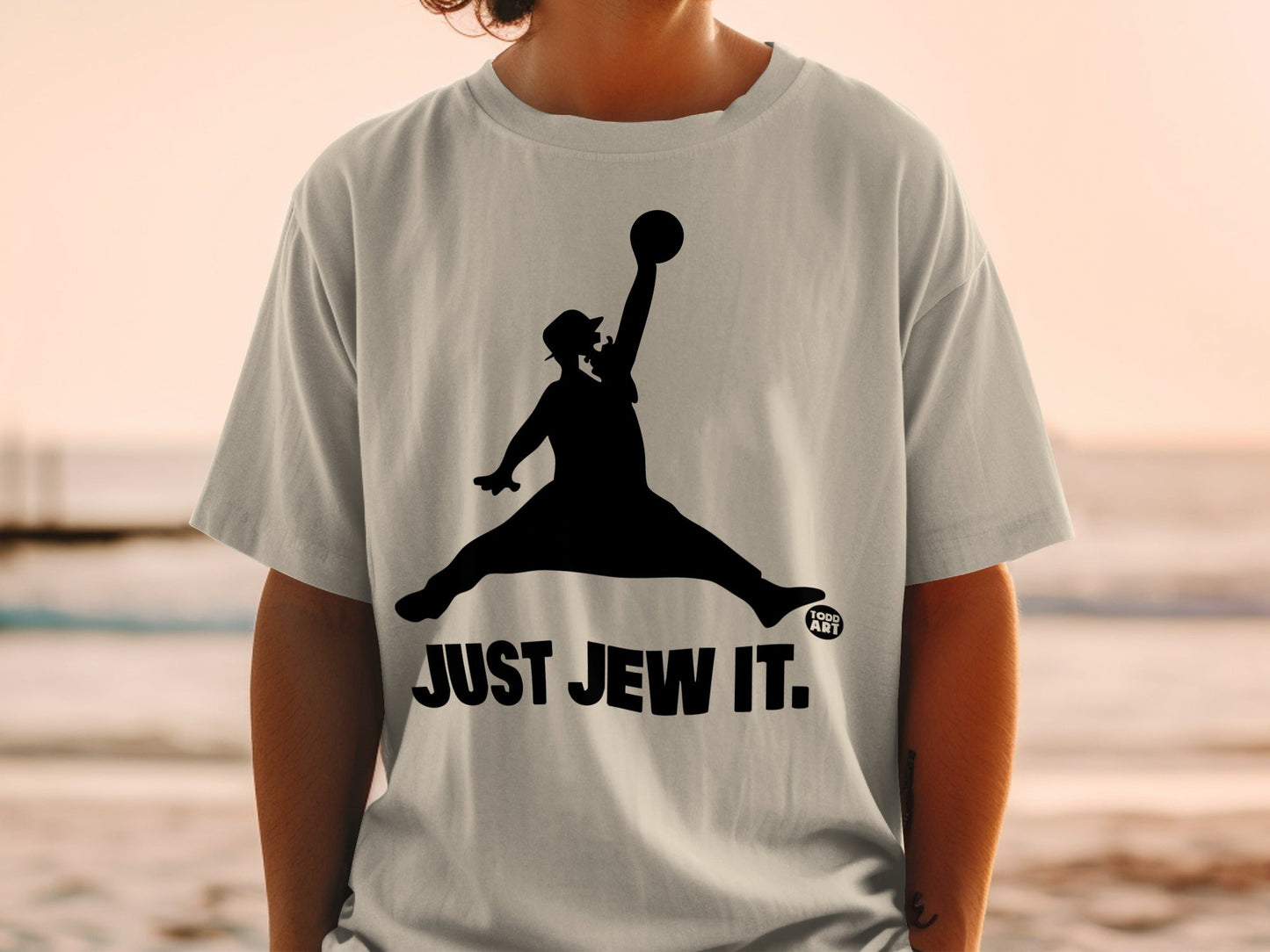 Black silhouette of a man in a hat jumping, wearing a t-shirt with "JUST JEW IT."
