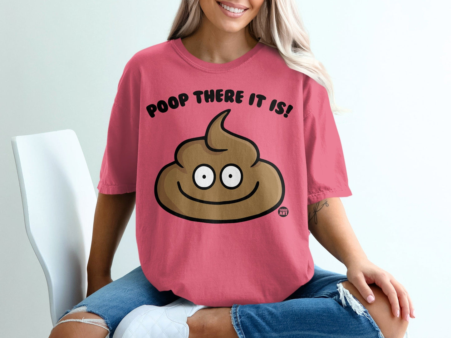 Pink t-shirt with a cartoon poop emoji and "Poop There It Is!" text.