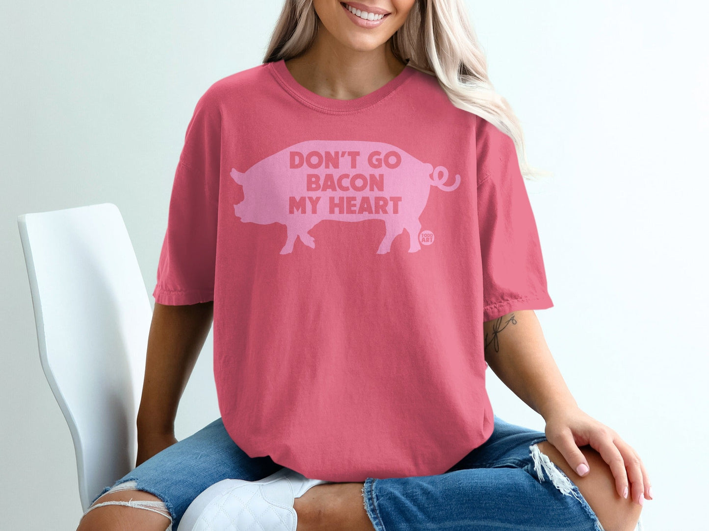 Pink t-shirt with "Don't Go Bacon My Heart" text and pig graphic.