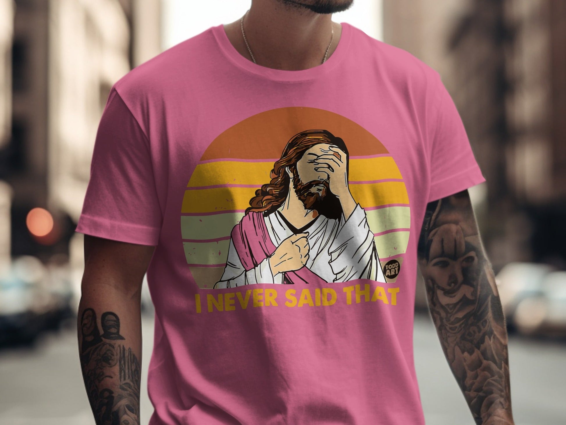 Pink t-shirt with Jesus graphic saying "I NEVER SAID THAT"
