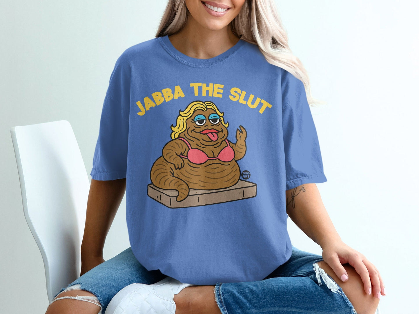 Blue t-shirt with "JABBA THE SLUT" text and cartoon Jabba the Hutt character.