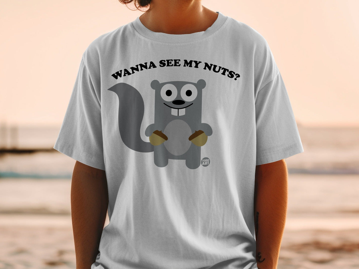 Cartoon squirrel holding acorns, text "WANNA SEE MY NUTS?".
