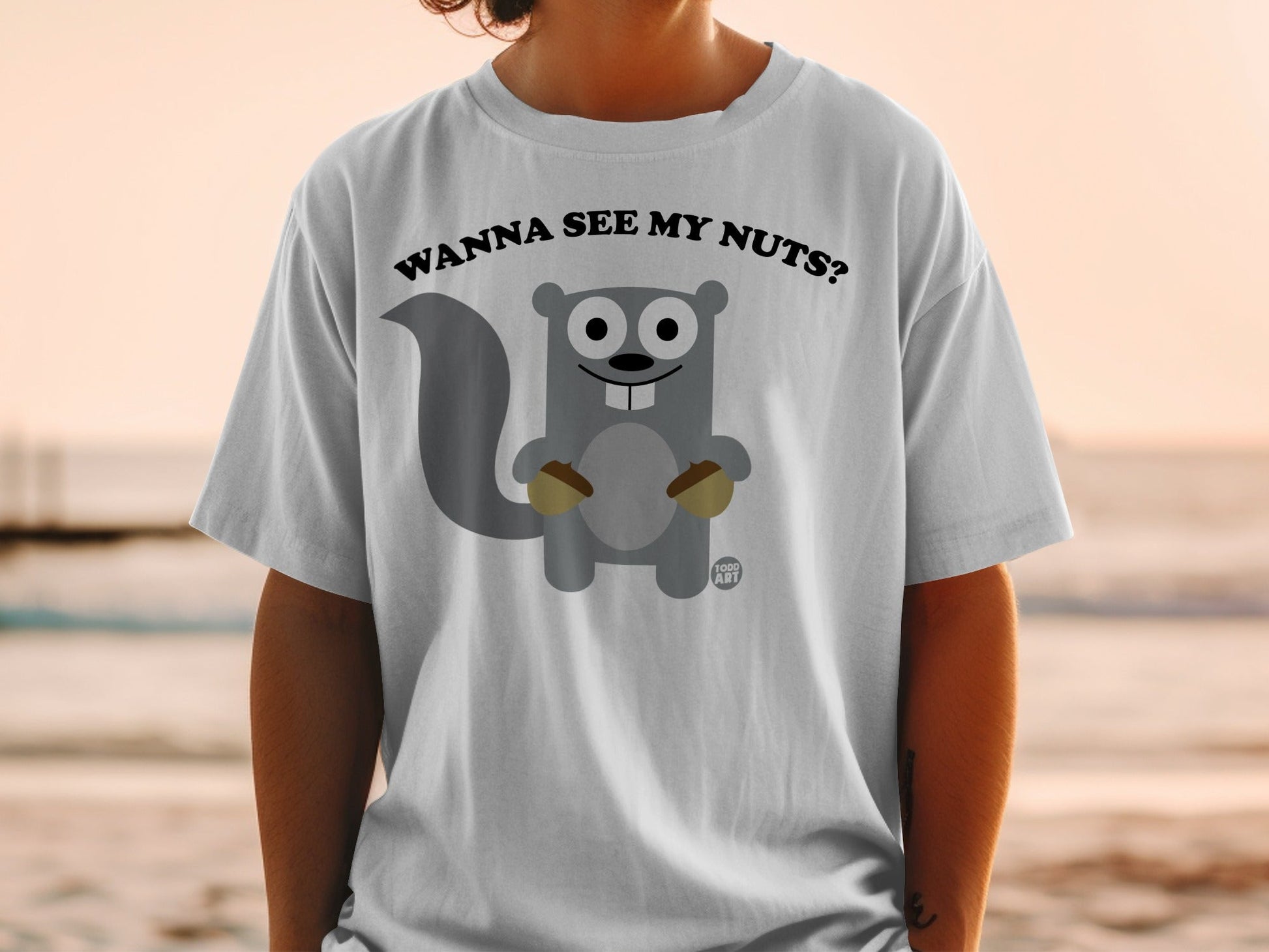 Cartoon squirrel holding acorns, text "WANNA SEE MY NUTS?".
