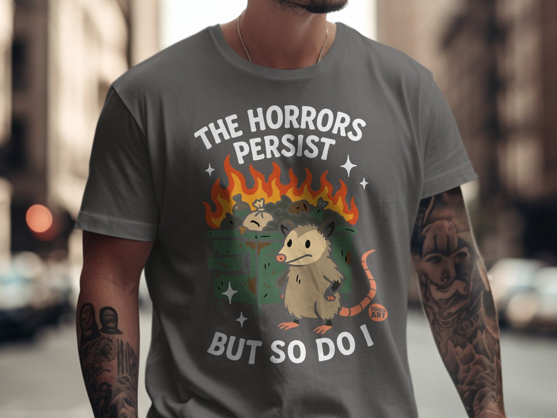 Opossum in trash fire, "The horrors persist but so do I" text.