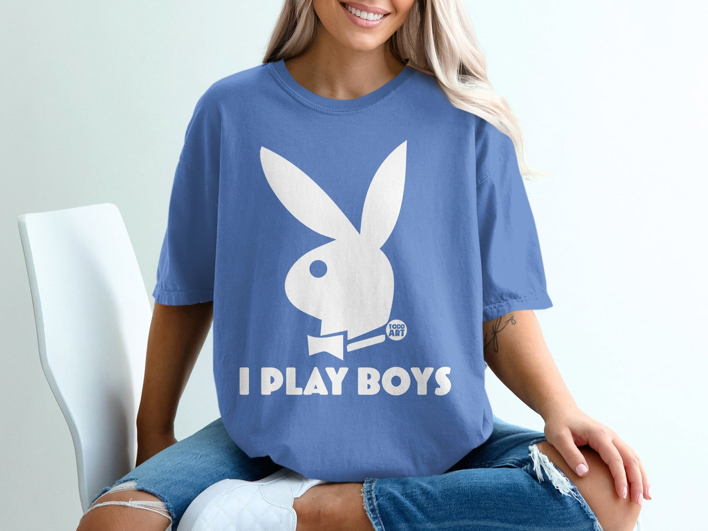 Blue t-shirt with white Playboy bunny logo and "I PLAY BOYS" text.
