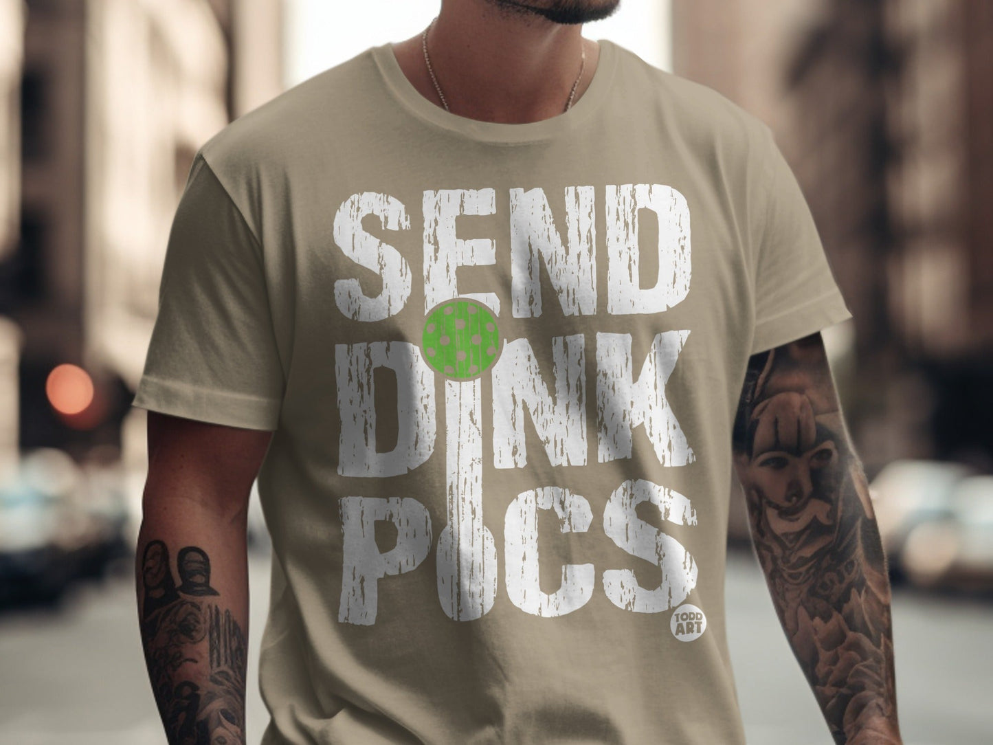 T-shirt with "SEND DINK PICS" text and pickleball graphic.