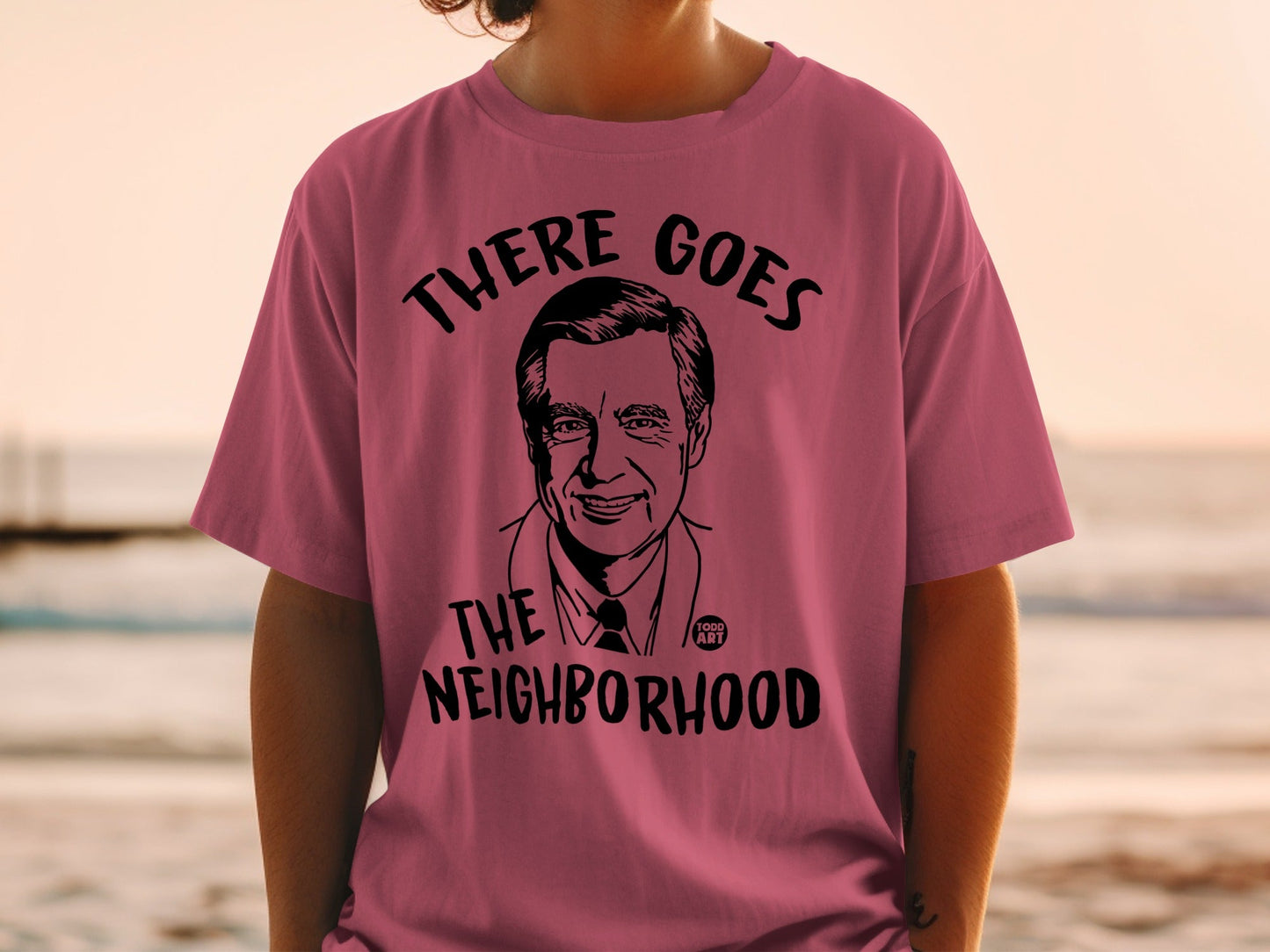 T-shirt with illustration of Fred Rogers and text "There Goes the Neighborhood".