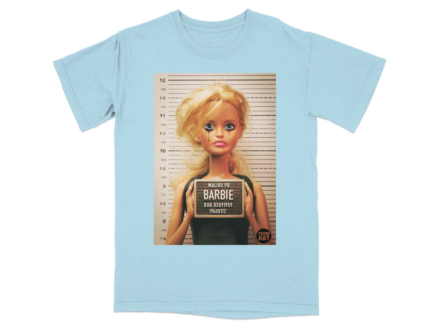Light blue t-shirt with Barbie mugshot graphic.