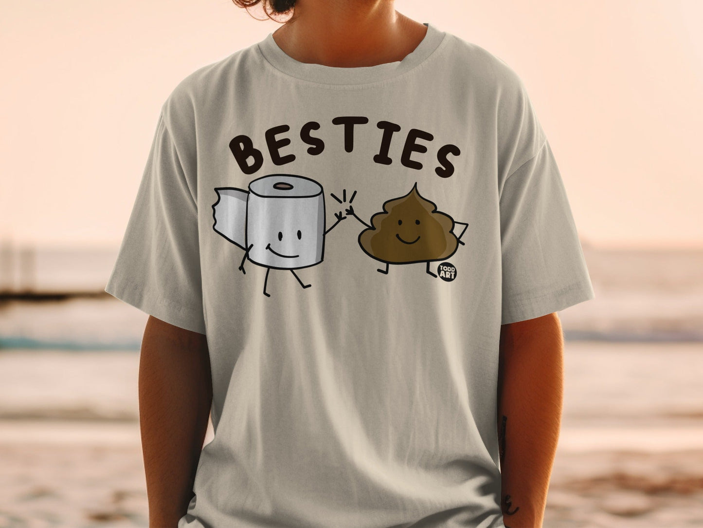 T-shirt with cartoon toilet paper and poop characters giving high fives.