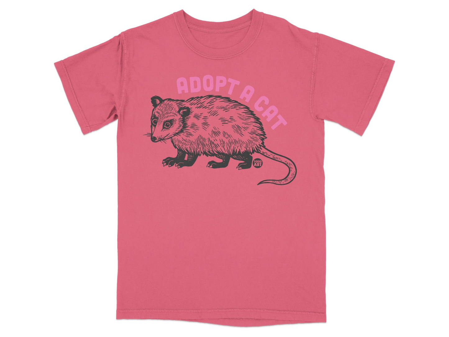 T-shirt with pink ink drawing of an opossum and "ADOPT A CAT" text.