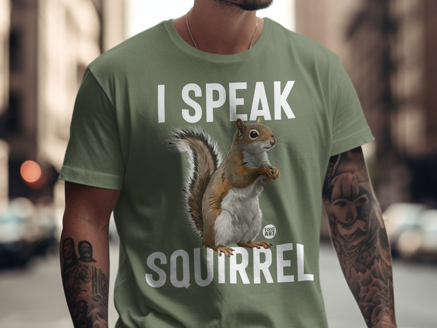 Green t-shirt with "I SPEAK SQUIRREL" text and a squirrel illustration.