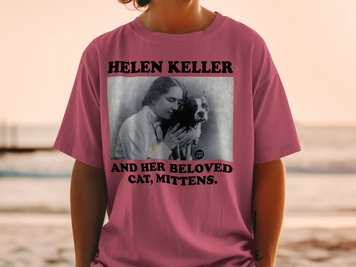 T-shirt featuring Helen Keller holding a dog named Mittens.