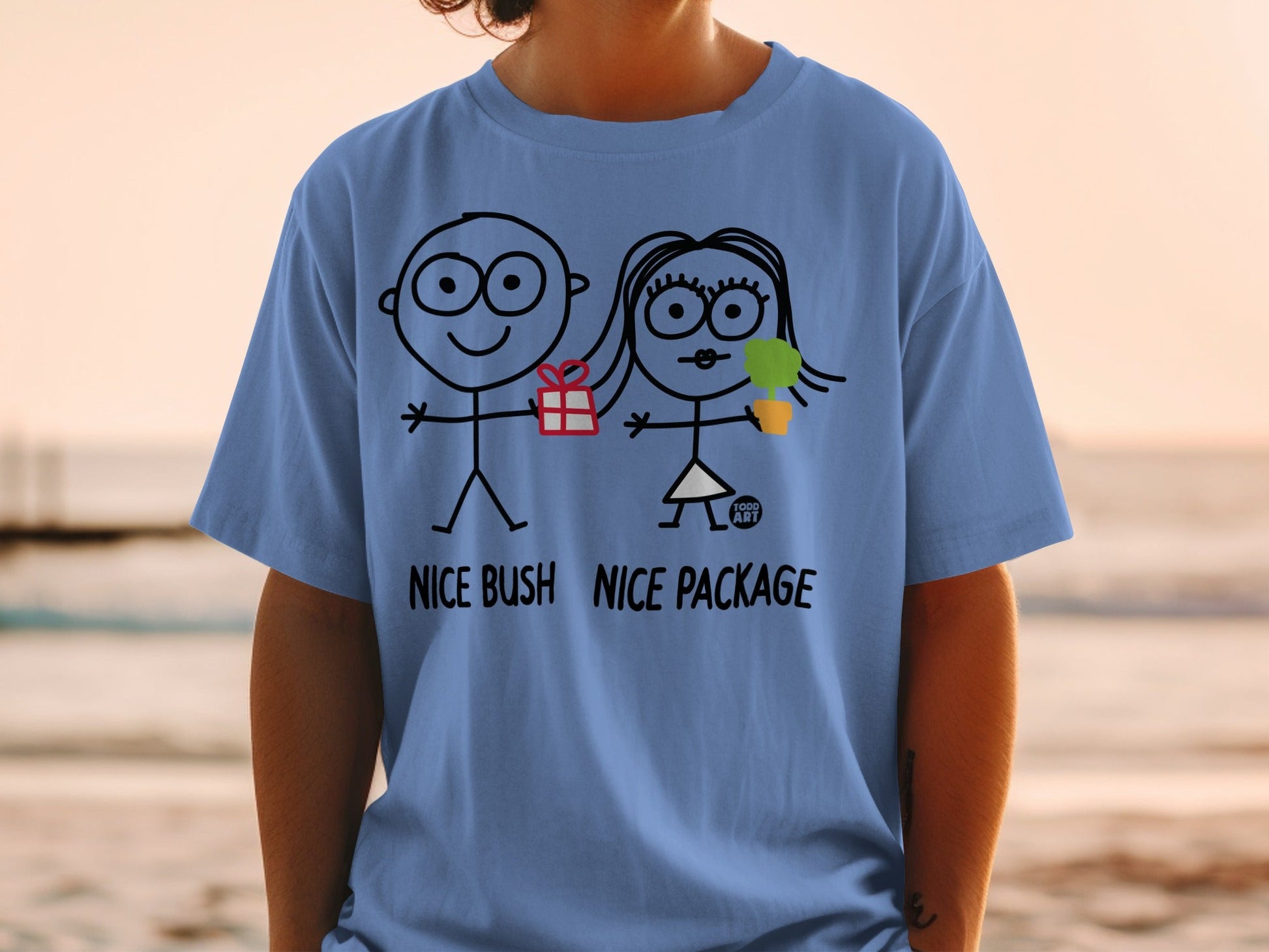 T-shirt with stick figures holding a gift and ice cream, text "NICE BUSH NICE PACKAGE".