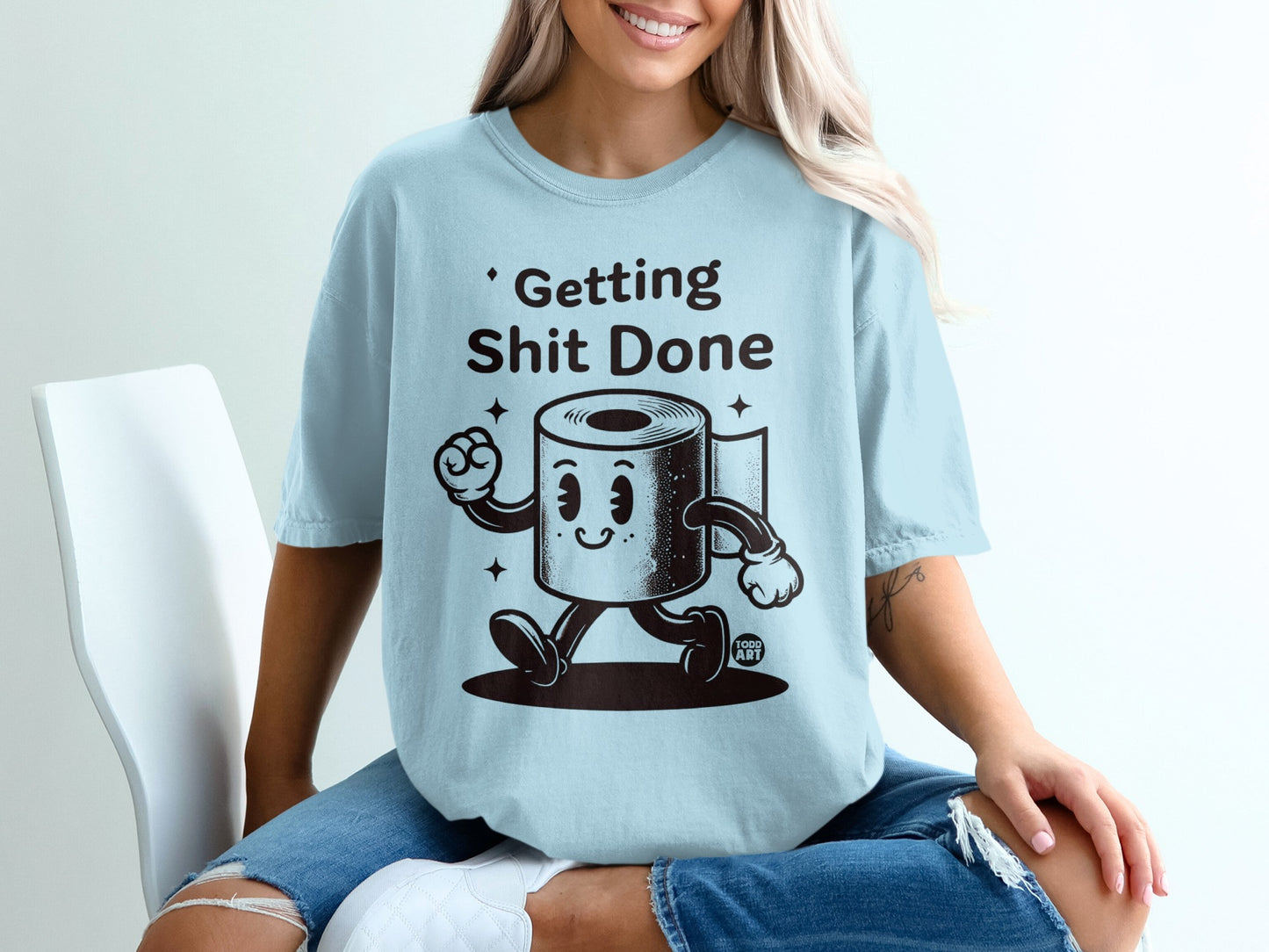 Light blue t-shirt with cartoon toilet paper character saying "Getting Shit Done."