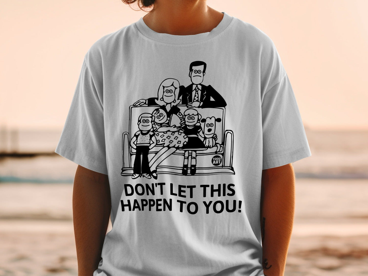 Graphic tee with family portrait and text "DON'T LET THIS HAPPEN TO YOU!".