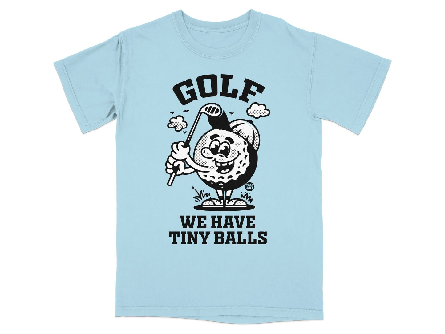 T-shirt with cartoon golf ball character swinging a golf club and text "GOLF WE HAVE TINY BALLS".