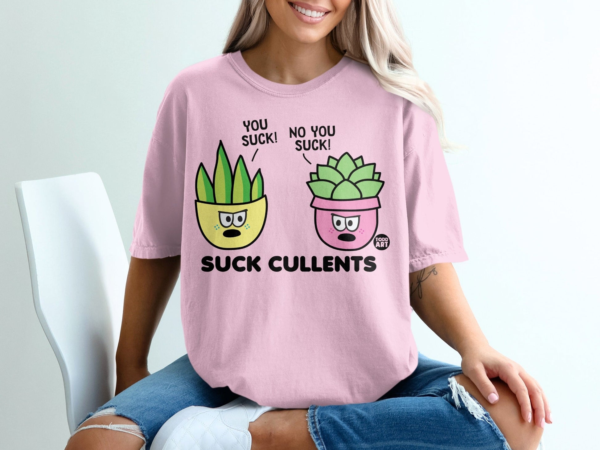 Pink t-shirt with cartoon succulents saying "you suck" and "no you suck"