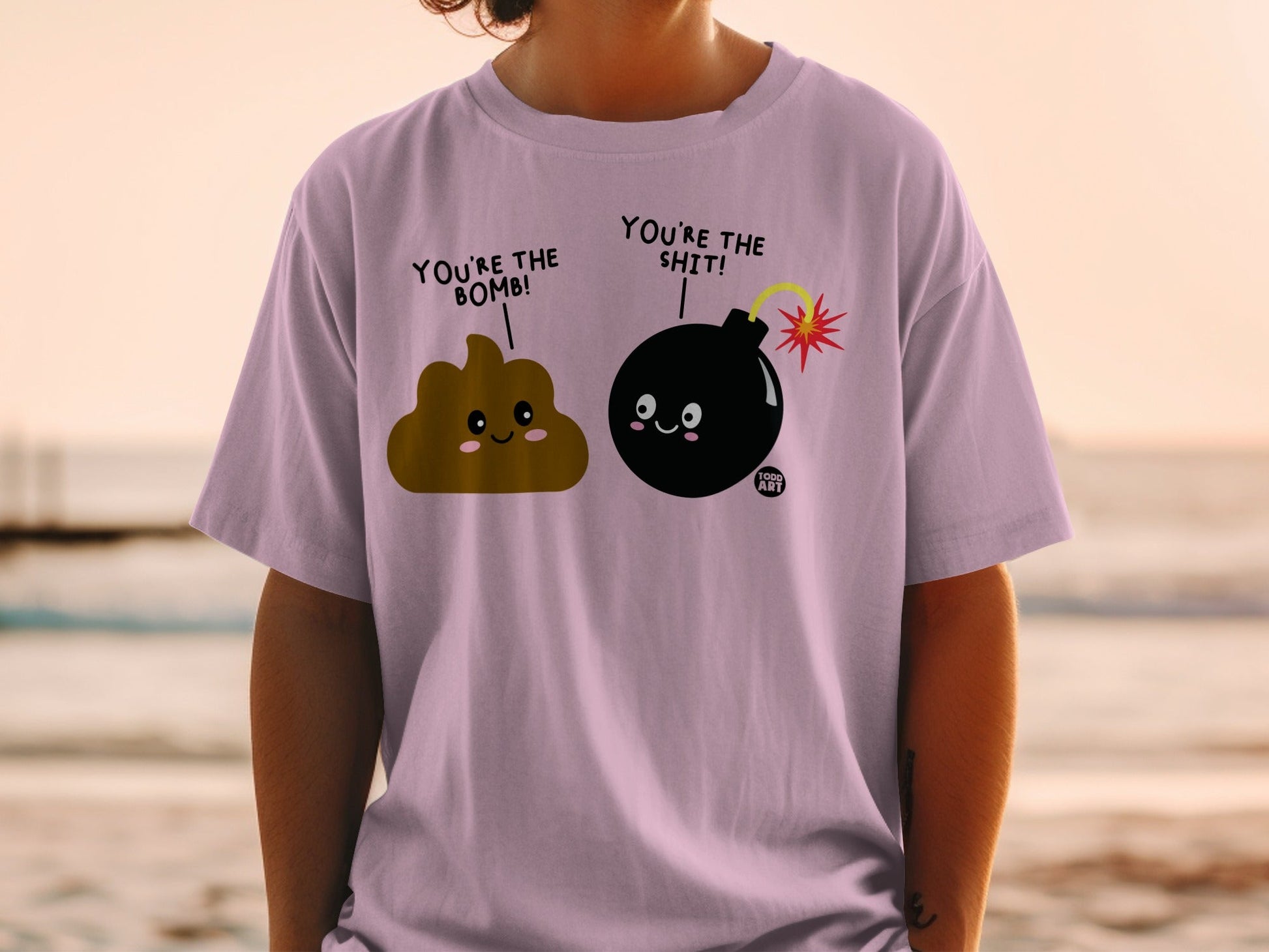 T-shirt with cartoon poop and bomb characters saying "You're the bomb!" and "You're the shit!".