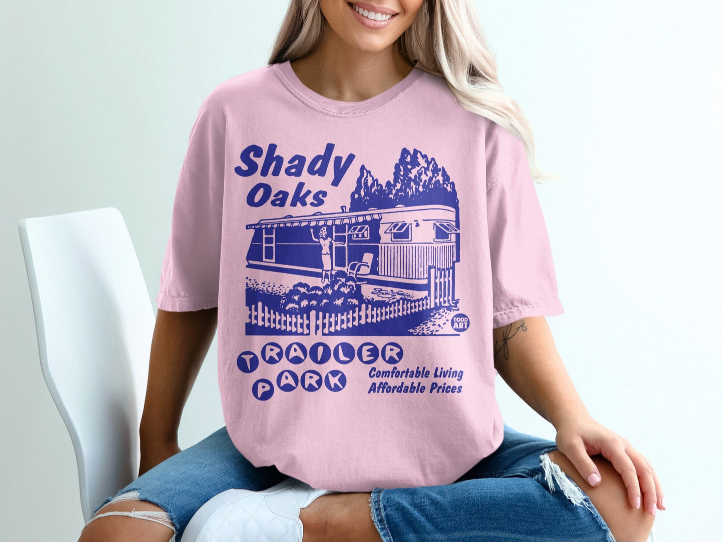 Pink t-shirt with "Shady Oaks Trailer Park" design.