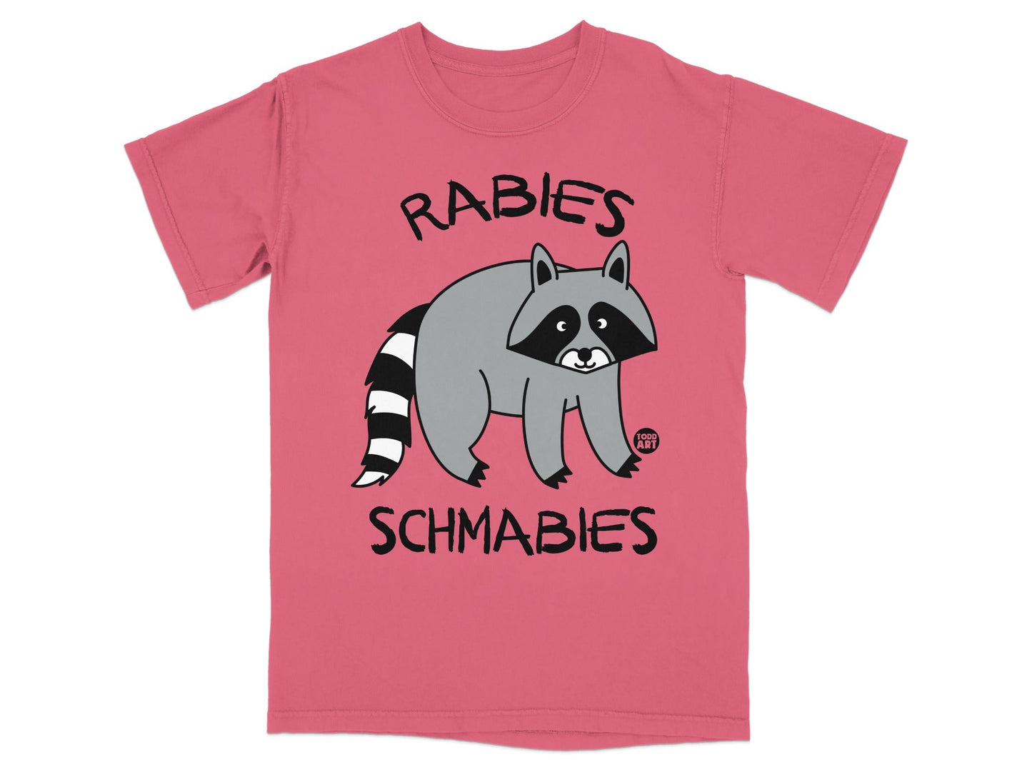 Coral t-shirt with a raccoon illustration and text "RABIES SCHMABIES".