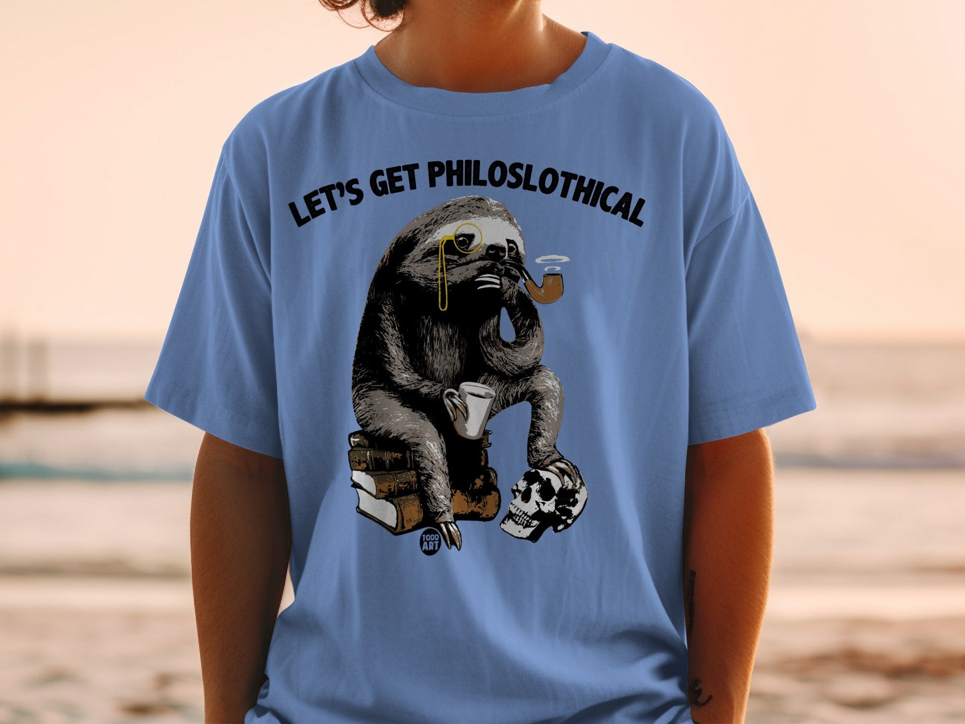 T-shirt with a sloth wearing glasses and smoking a pipe, holding a mug.