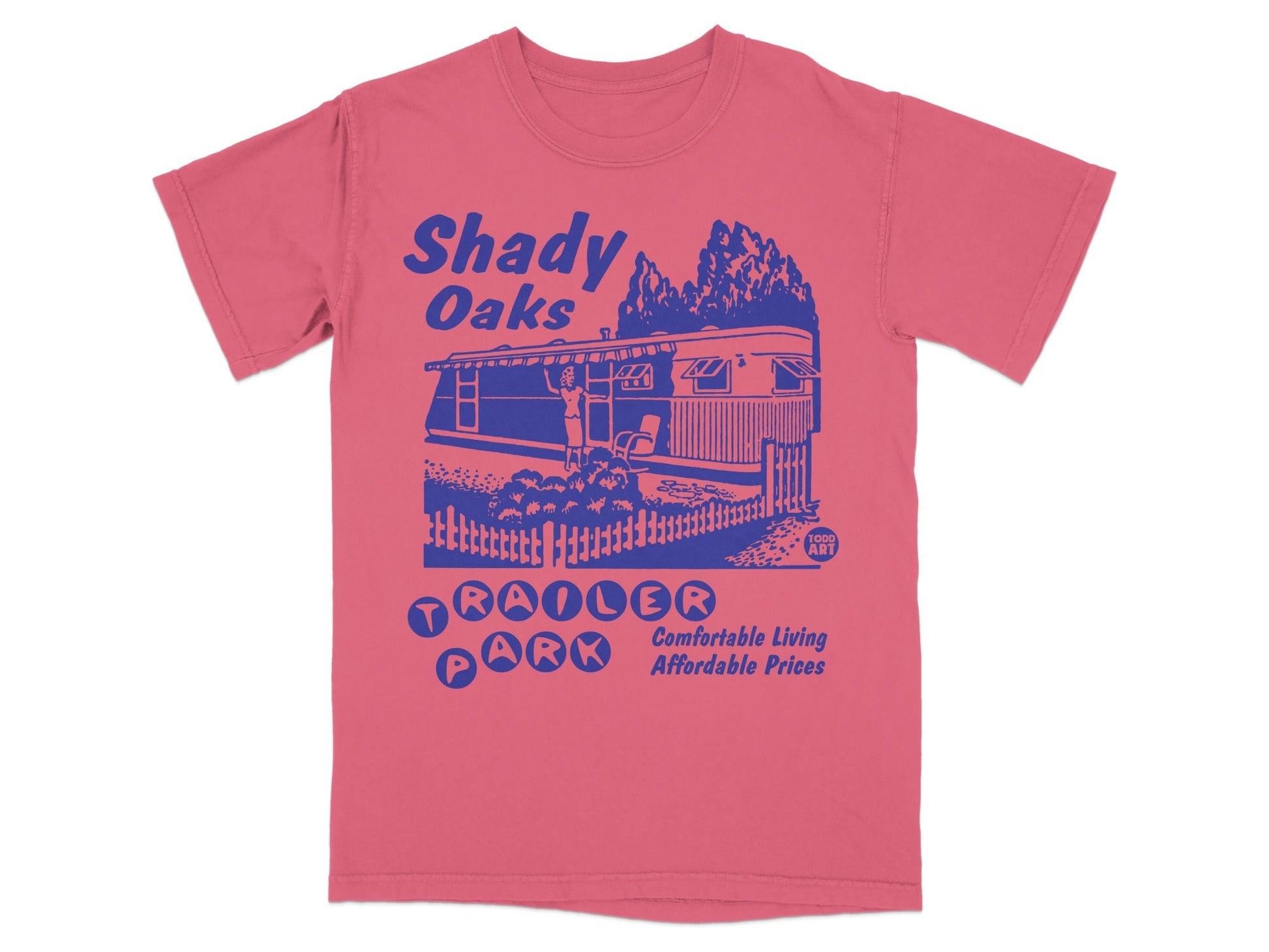 Pink t-shirt with blue text and graphic of Shady Oaks Trailer Park.
