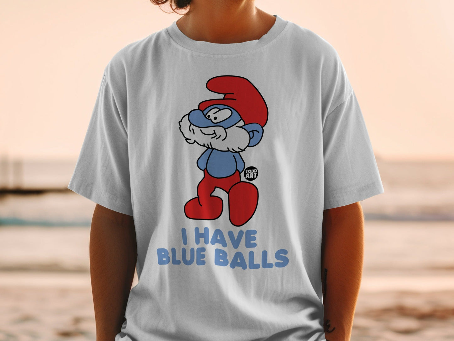Smurf character on white t-shirt with "I HAVE BLUE BALLS" text.