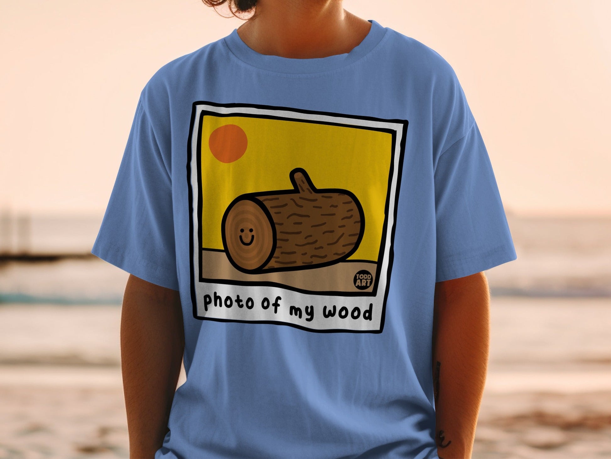 T-shirt with "photo of my wood" and a smiling log illustration.
