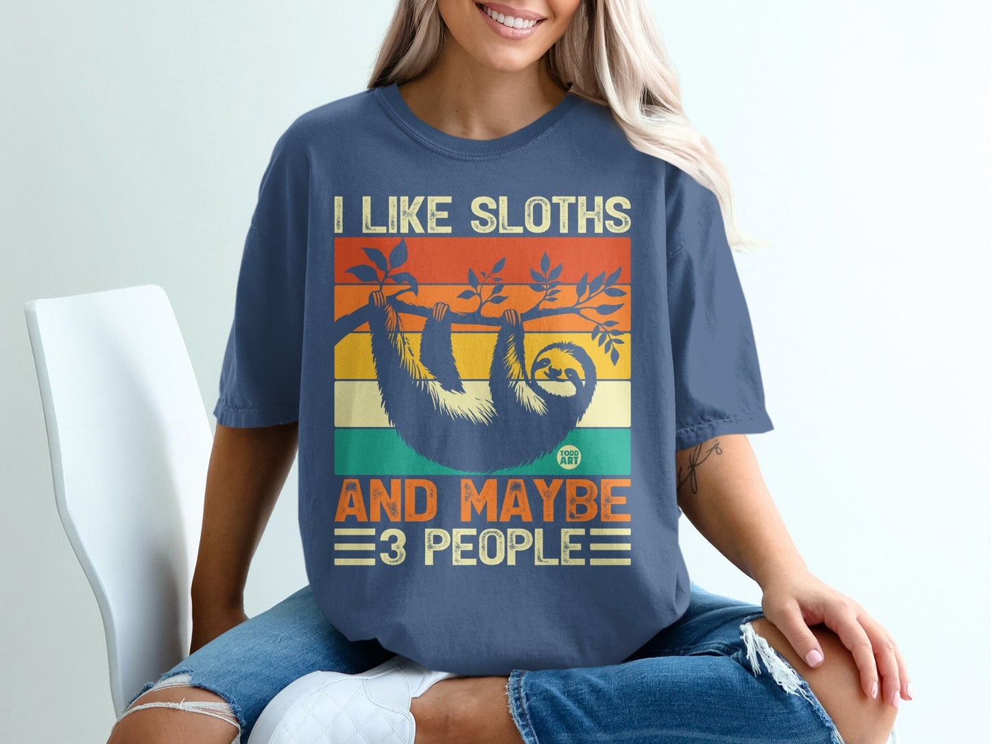 Retro sunset graphic tee with sloth and text "I like sloths and maybe 3 people."
