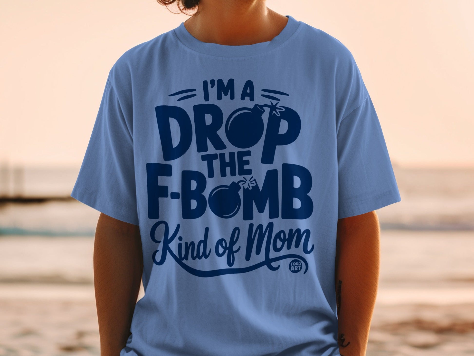 Blue t-shirt with "I'm a drop the F-bomb kind of mom" graphic.