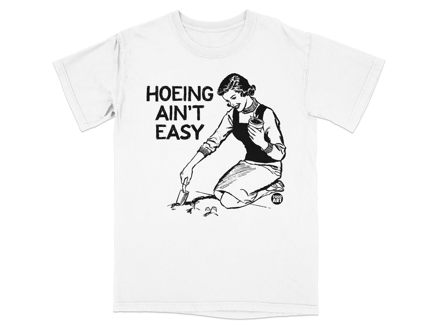 T-shirt with graphic of woman gardening and text "HOEING AIN'T EASY".