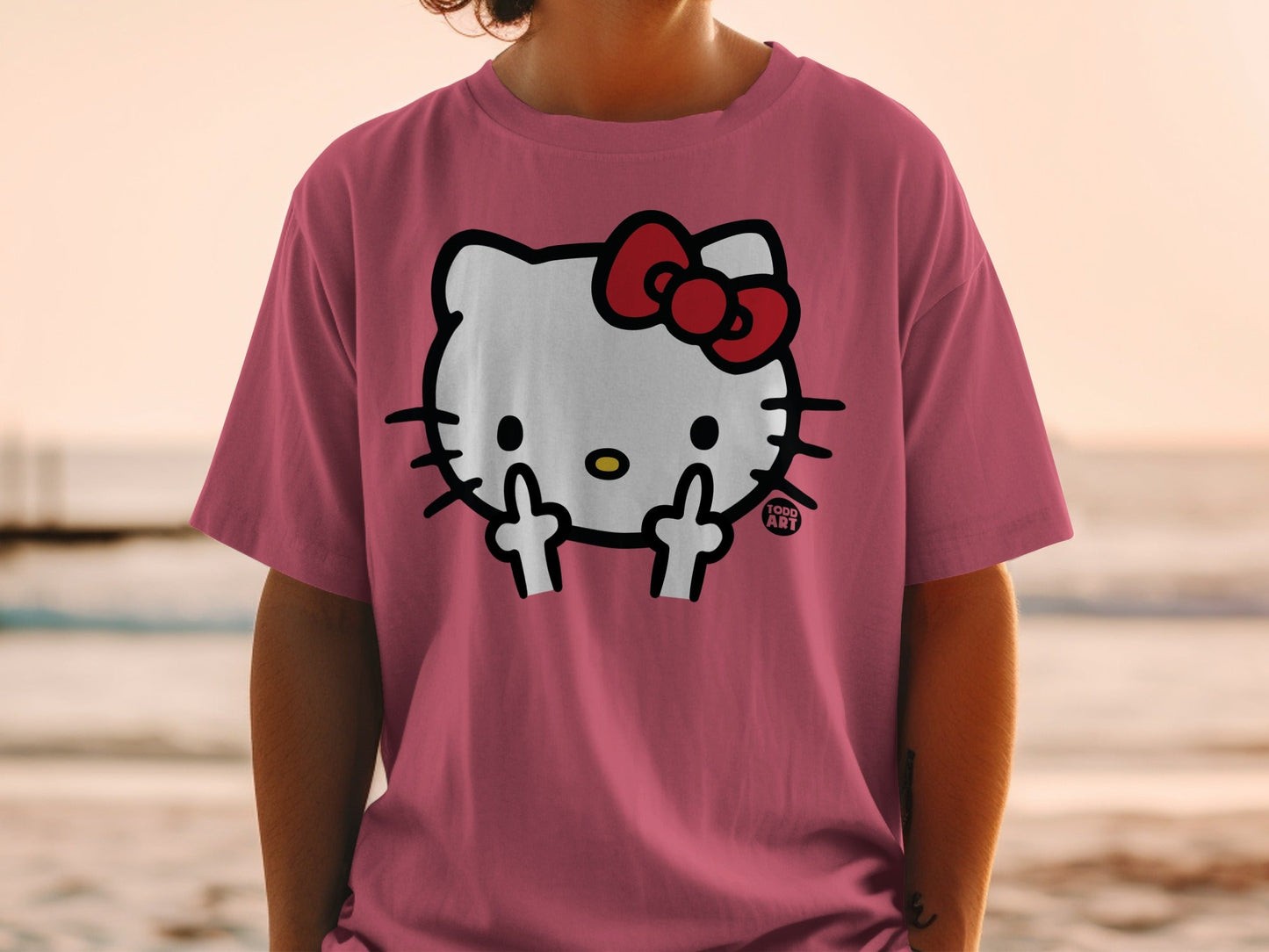 Pink t-shirt with Hello Kitty giving the middle finger.