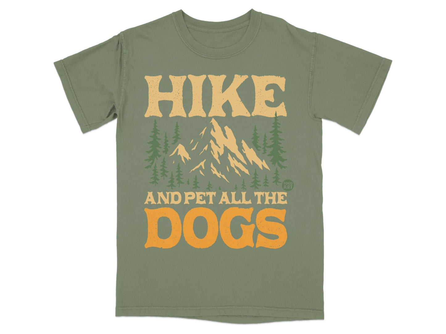 Green t-shirt with mountains, trees, and "HIKE AND PET ALL THE DOGS" text.