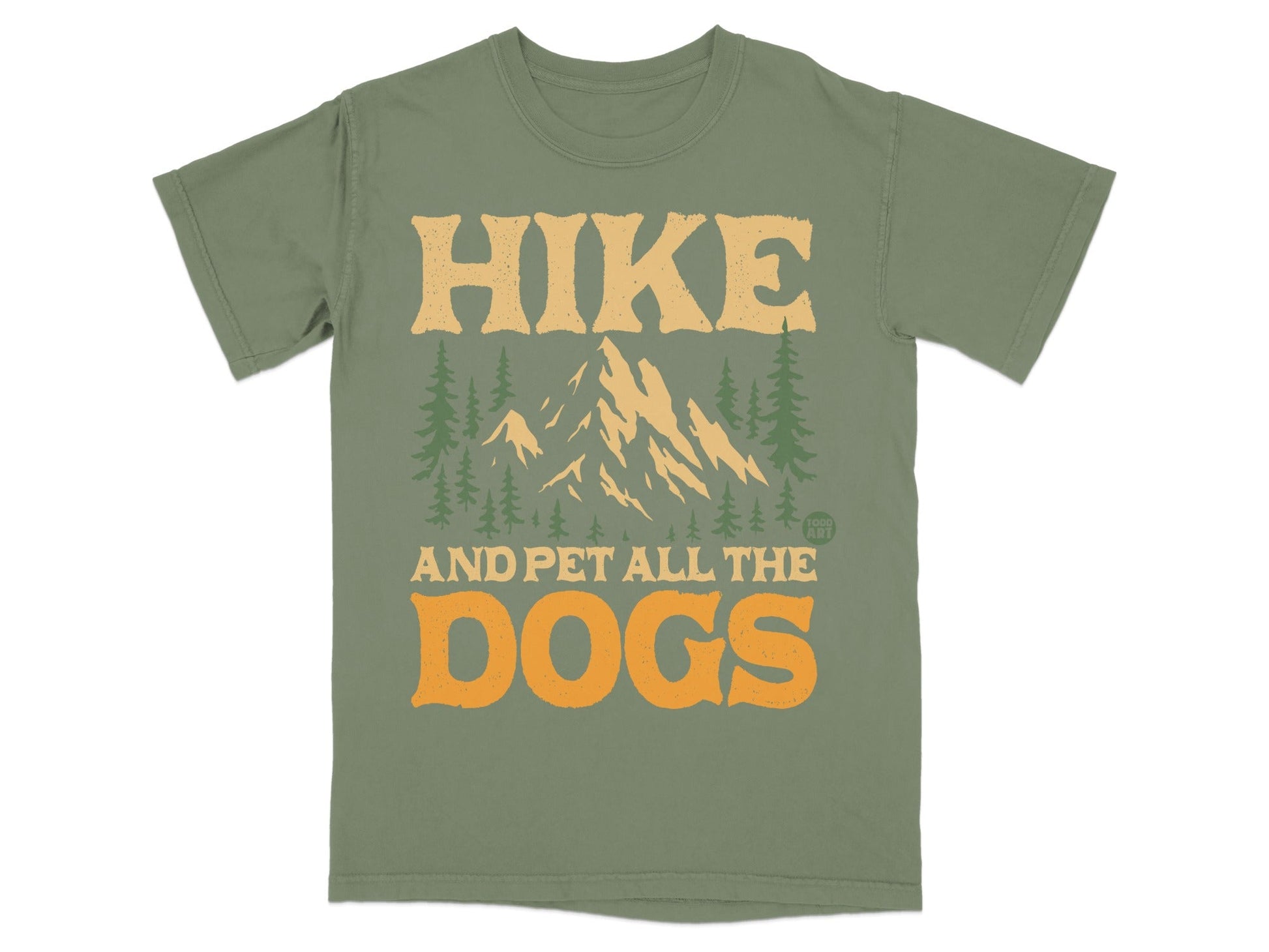 Green t-shirt with mountains, trees, and "HIKE AND PET ALL THE DOGS" text.