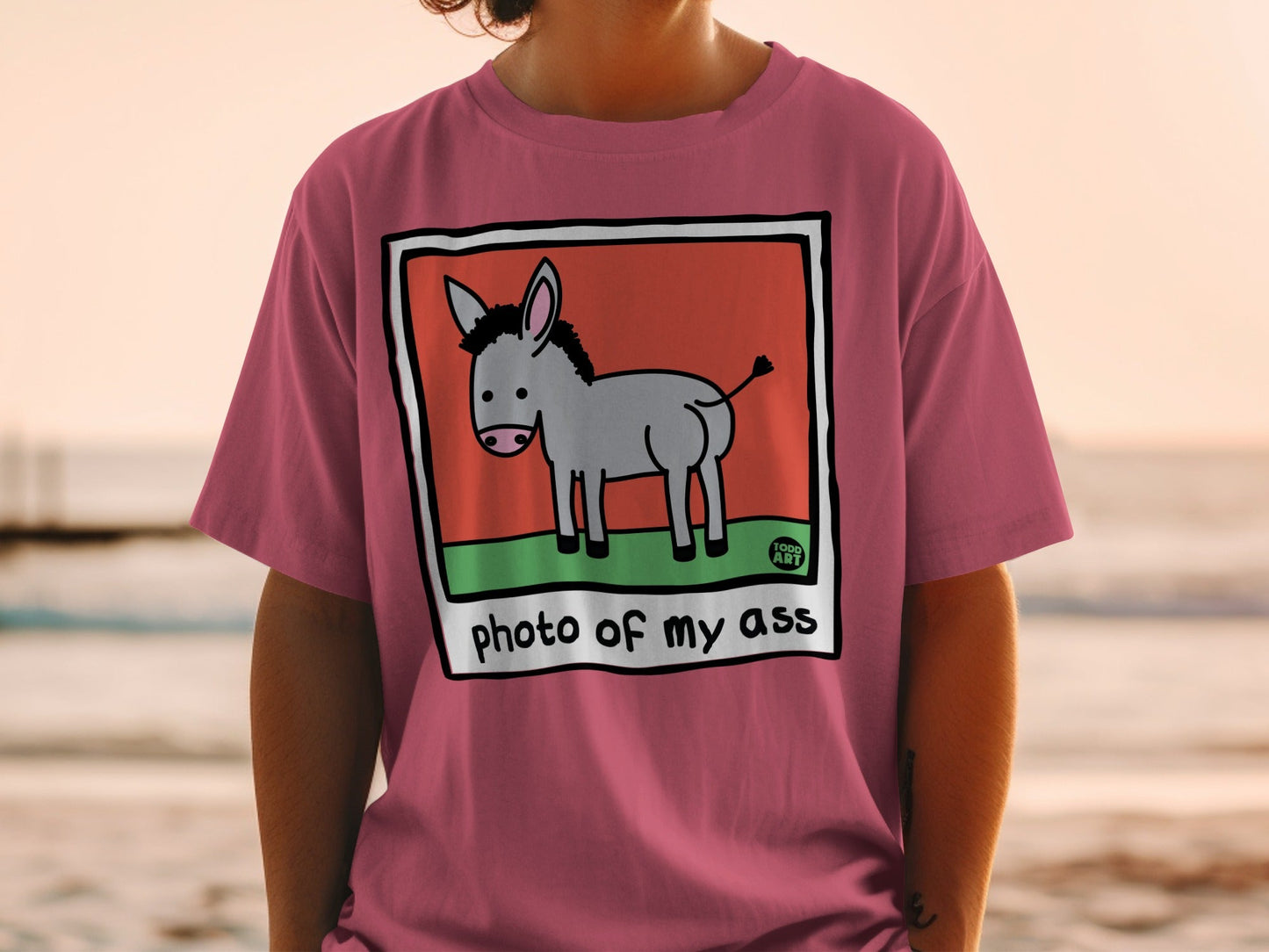 Cartoon donkey in a frame with text "photo of my ass" below.