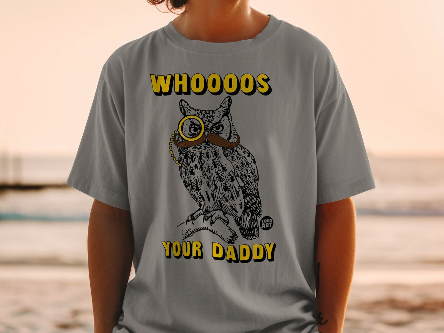 Grey t-shirt with owl wearing monocle and mustache, text reads "WHOOO'S YOUR DADDY".