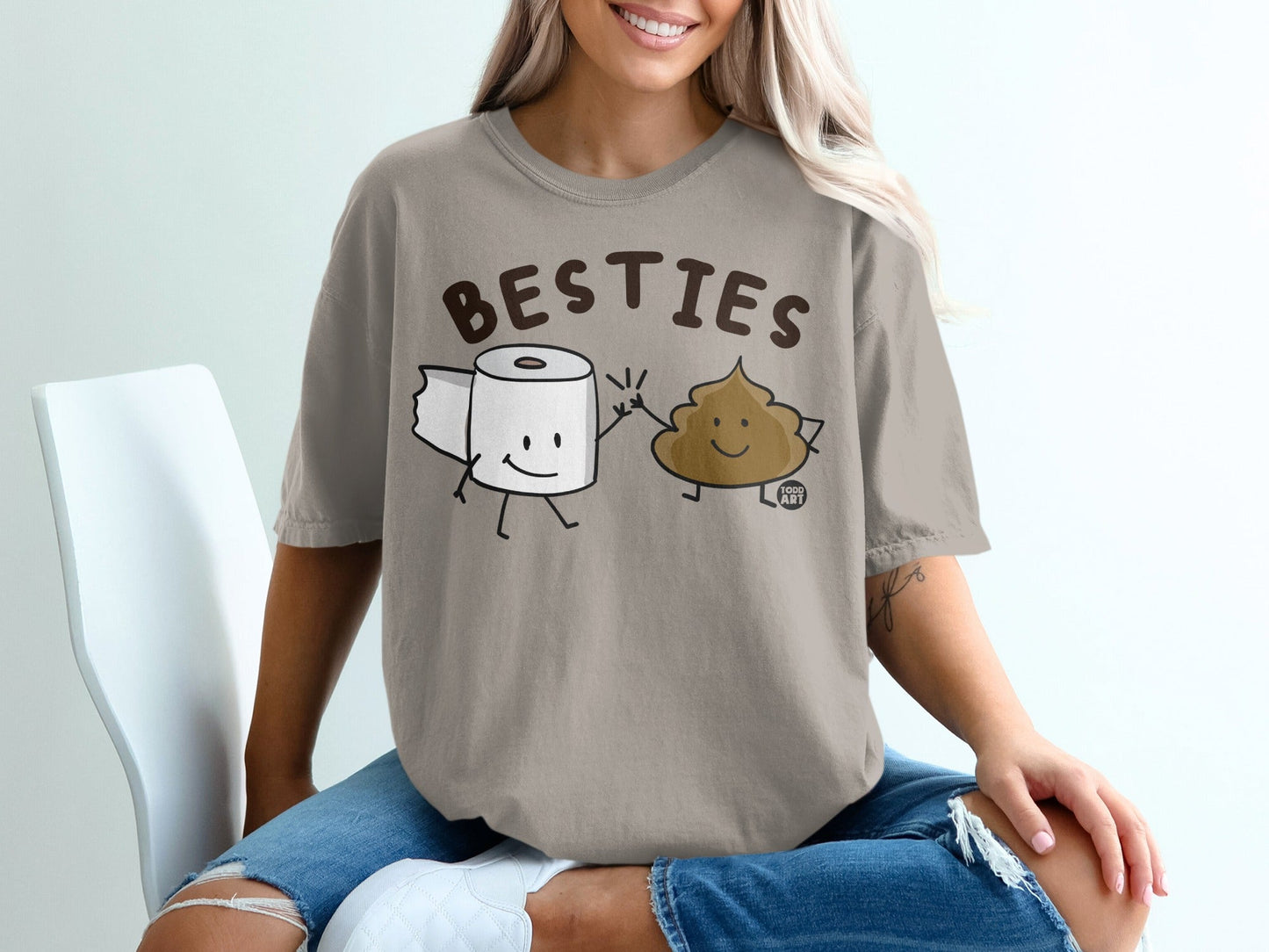 T-shirt with cartoon toilet paper roll and smiling poop character saying "BESTIES".