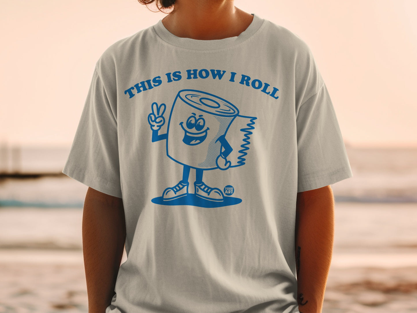 T-shirt featuring a cartoon toilet paper roll giving a peace sign.