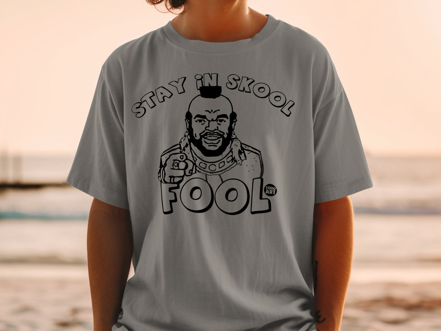T-shirt with Mr. T graphic saying "STAY IN SKOOL FOOL".