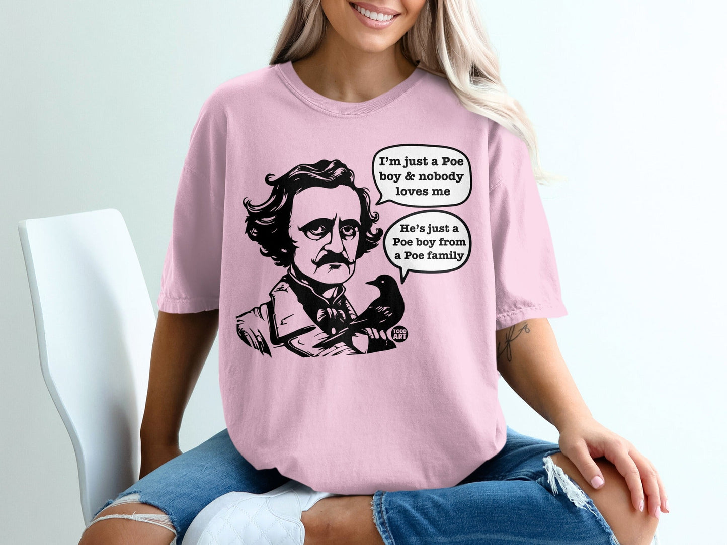 Pink t-shirt with Edgar Allan Poe cartoon and dialogue bubbles.