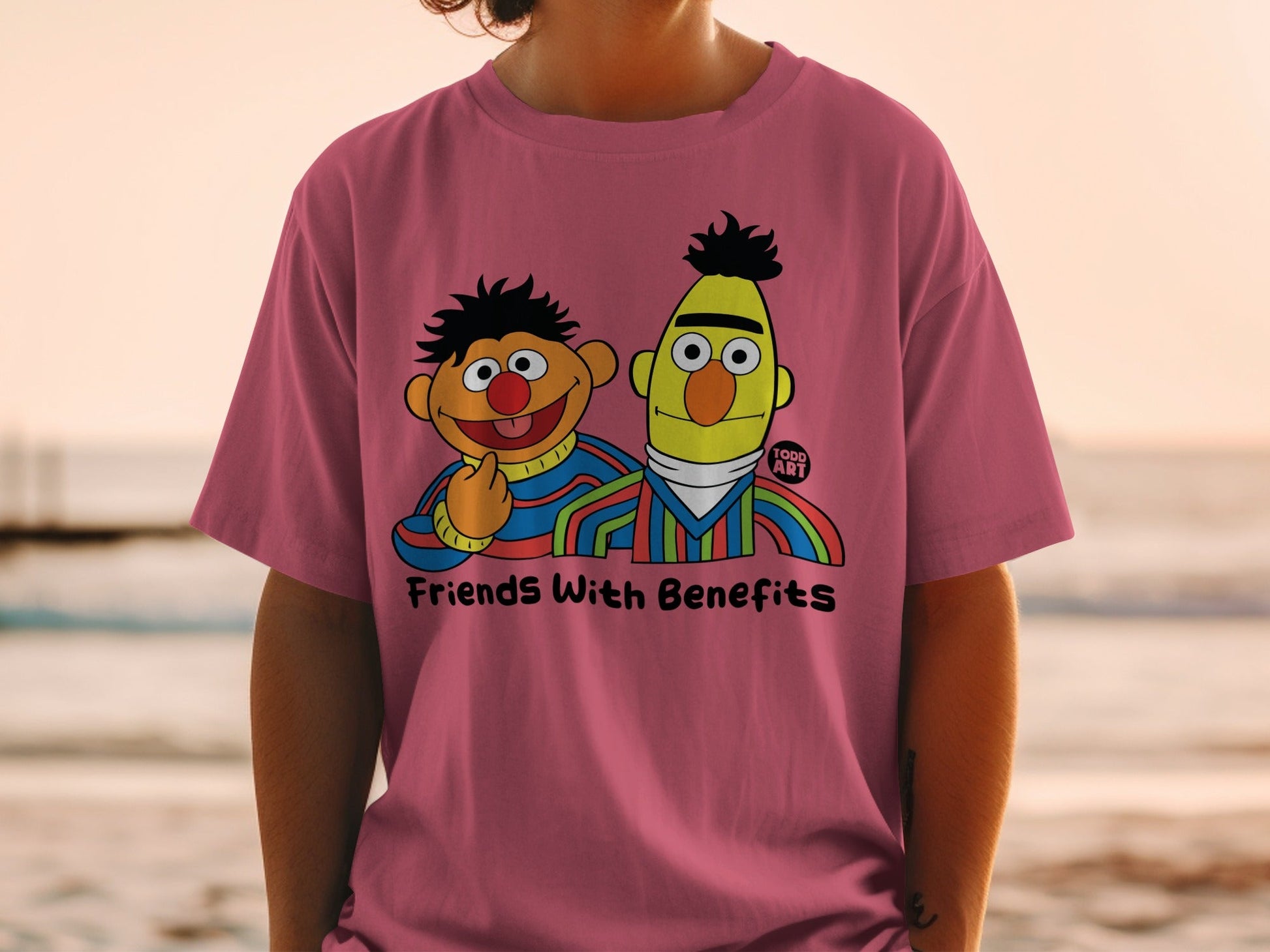 Bert and Ernie from Sesame Street on a pink t-shirt reading "Friends With Benefits".