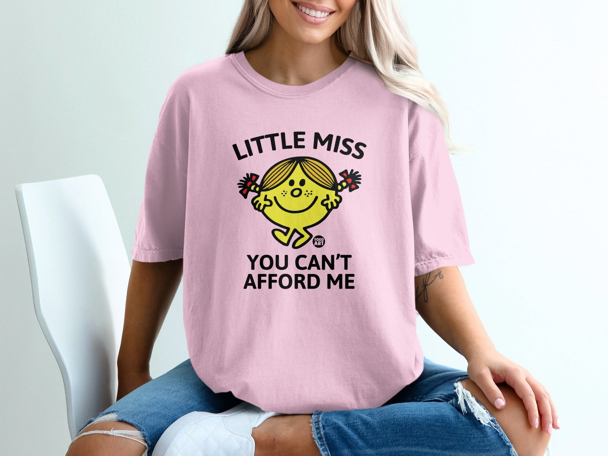 Pink t-shirt with "Little Miss You Can't Afford Me" text and graphic.