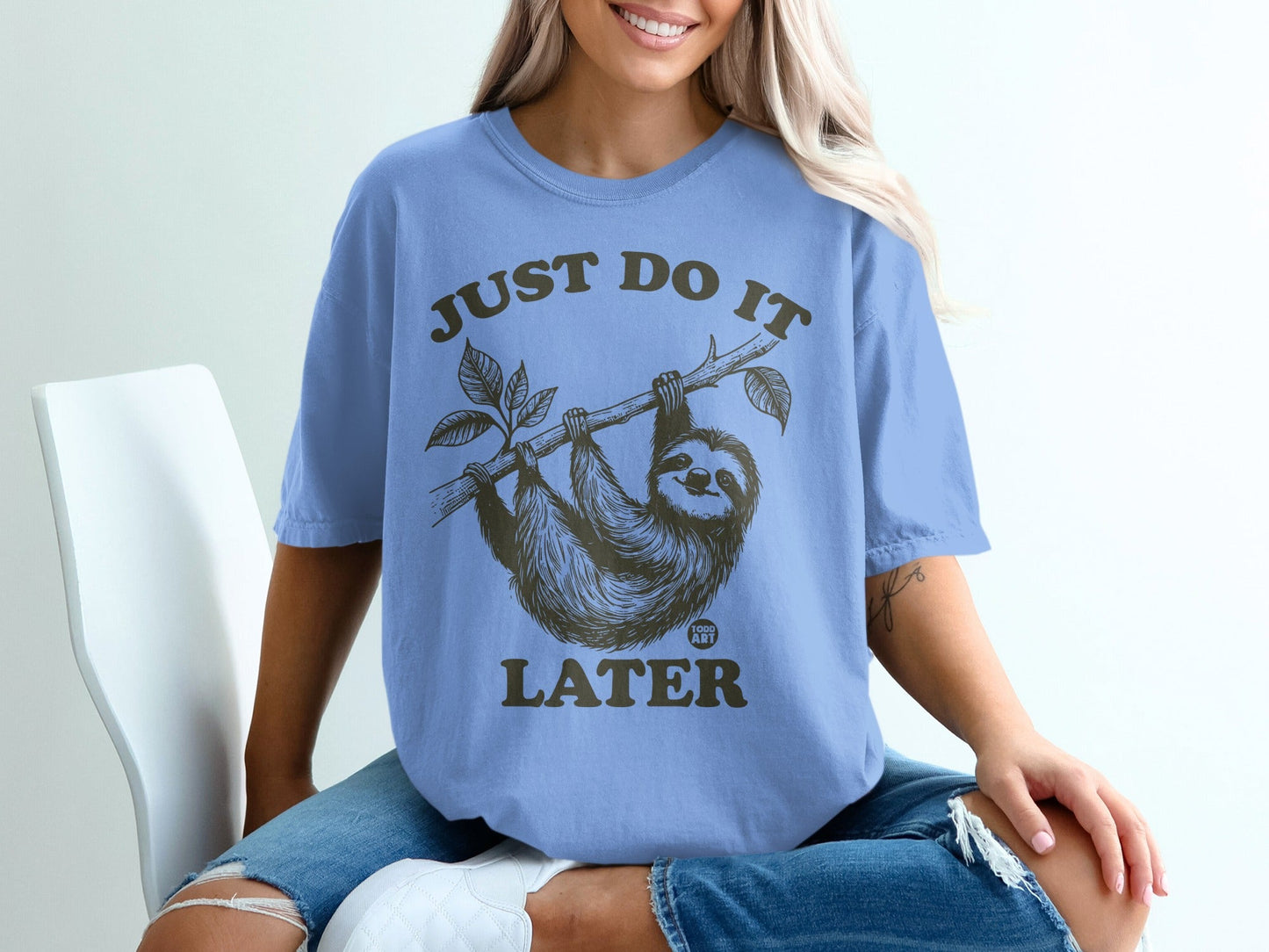 T-shirt with sloth on branch saying "Just Do It Later"