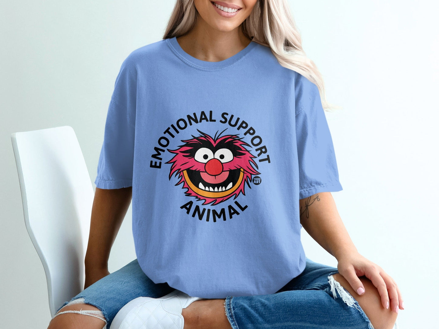 Blue t-shirt with "Emotional Support Animal" text and cartoon animal graphic.