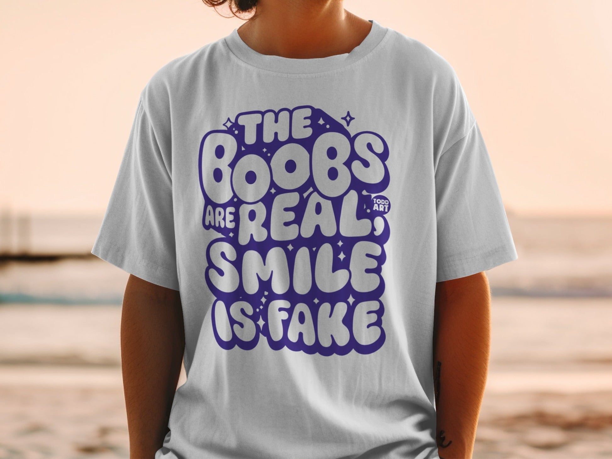 The Boobs Are Real Smile Is Fake Graphic Tee