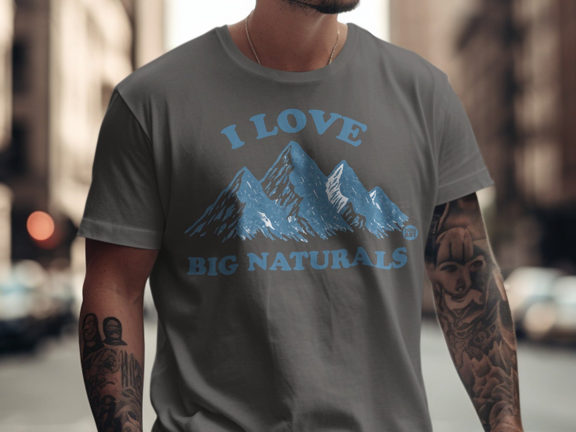 Grey t-shirt with blue mountain graphic and text "I LOVE BIG NATURALS".