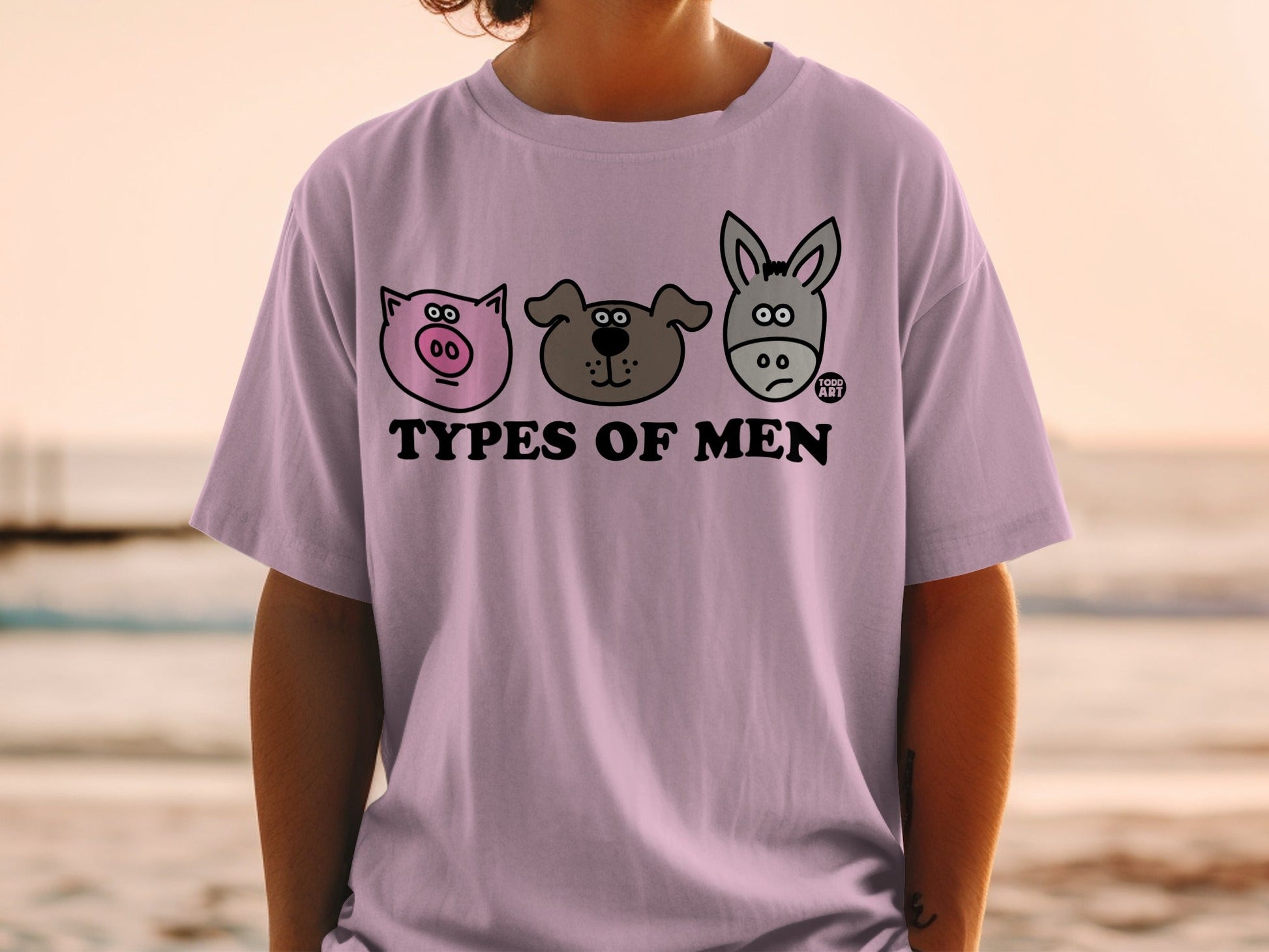 Purple t-shirt with three cartoon animal faces: pig, dog, and donkey.