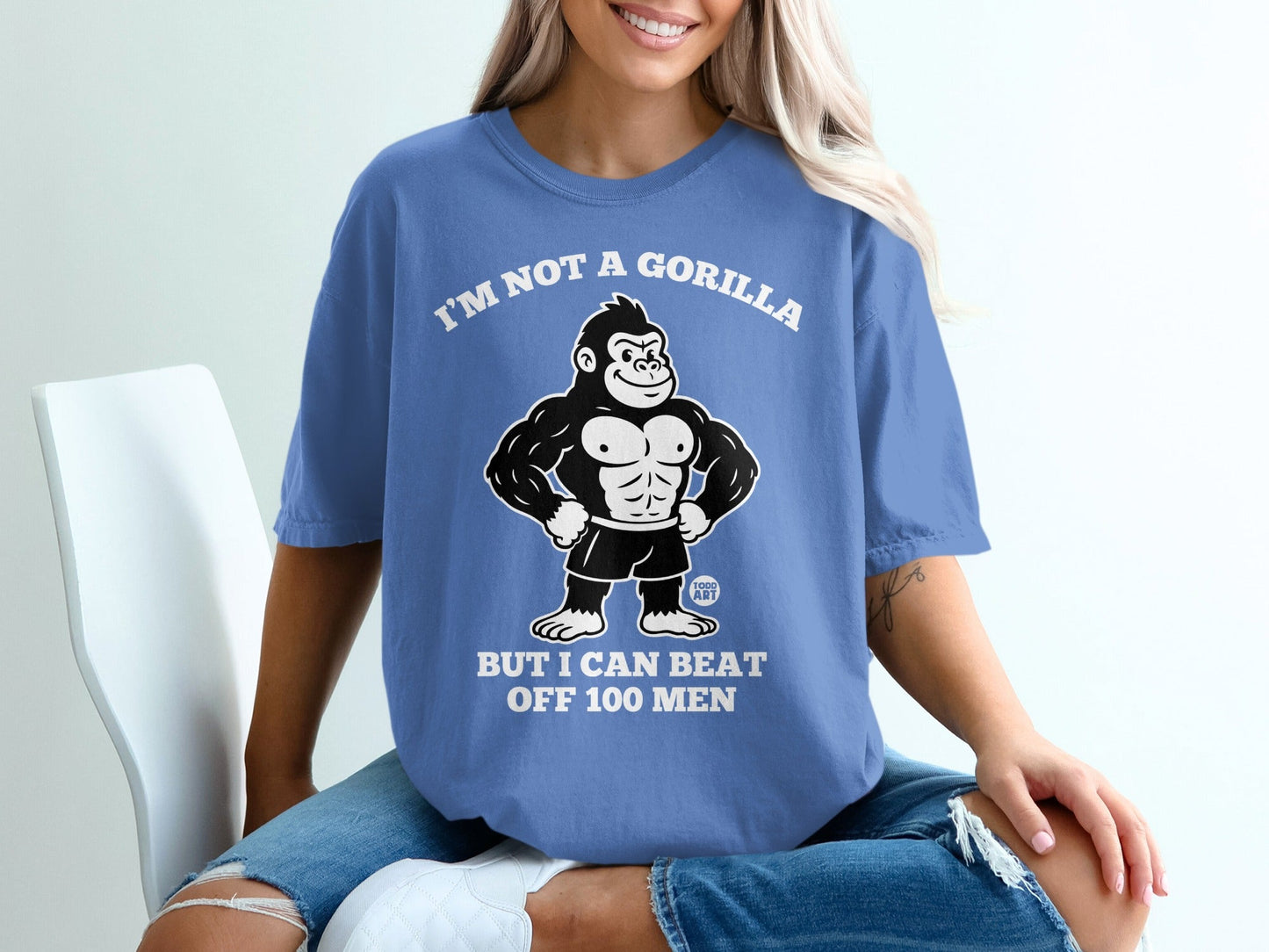 Blue t-shirt with cartoon gorilla and text "I'm not a gorilla but I can beat off 100 men".