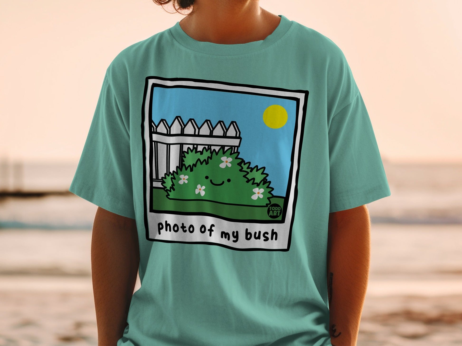 Cartoon bush with smiling flowers, "photo of my bush" text.